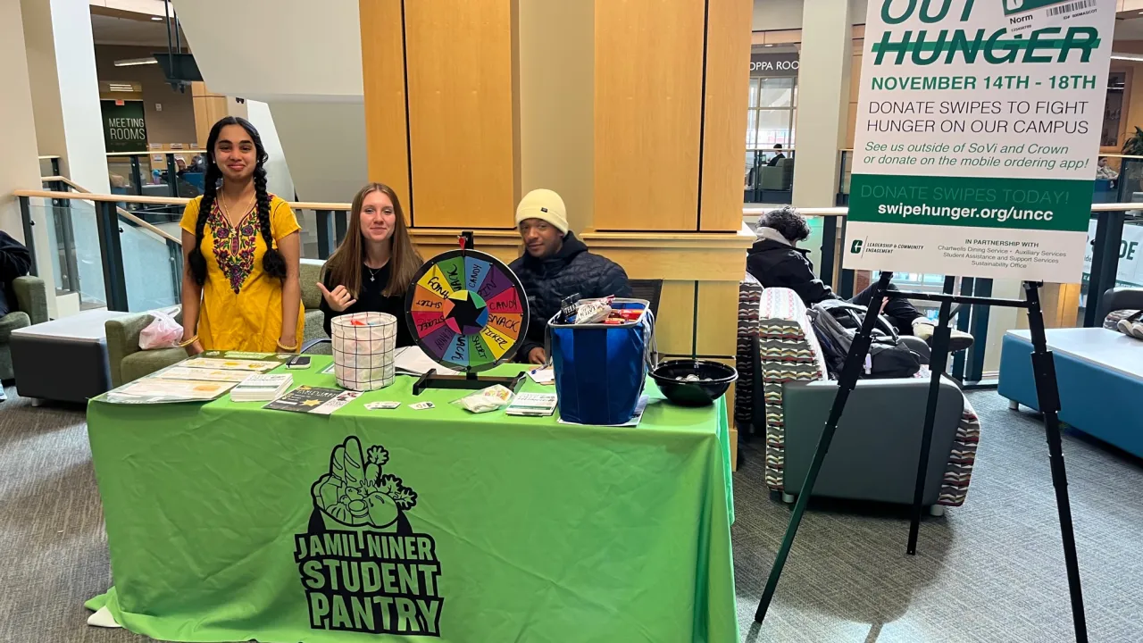 Swipe Out Hunger table with volunteers at the Union